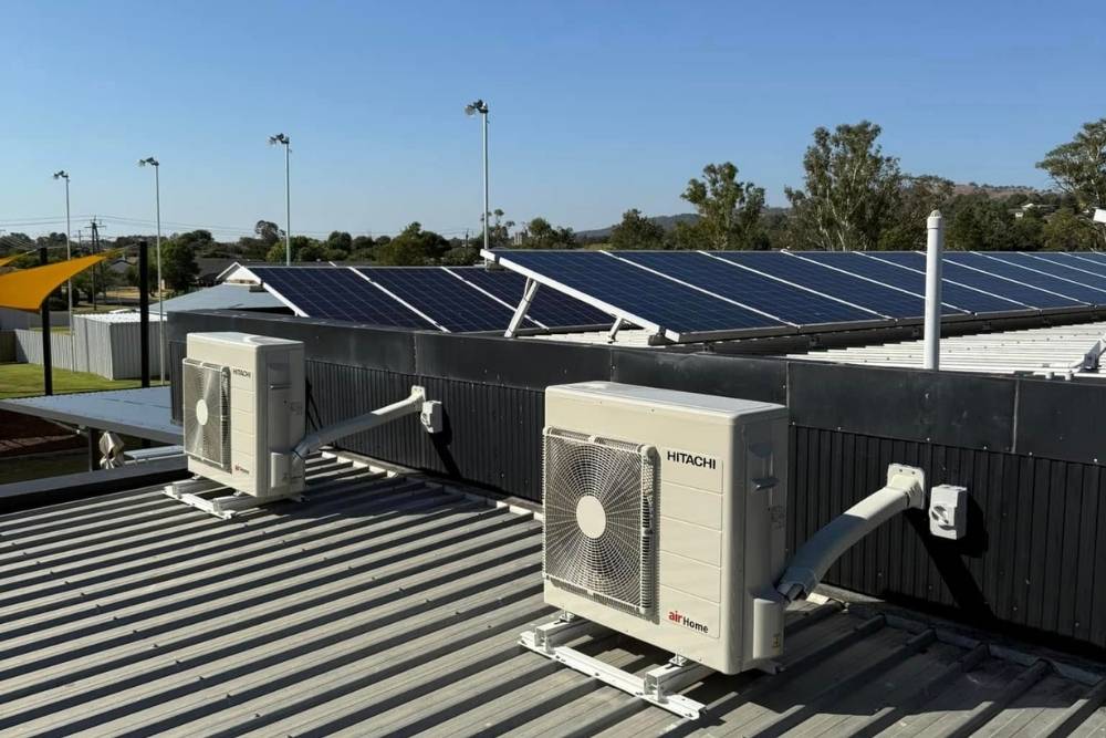Hitachi air conditioning units on a corrugated metal roof